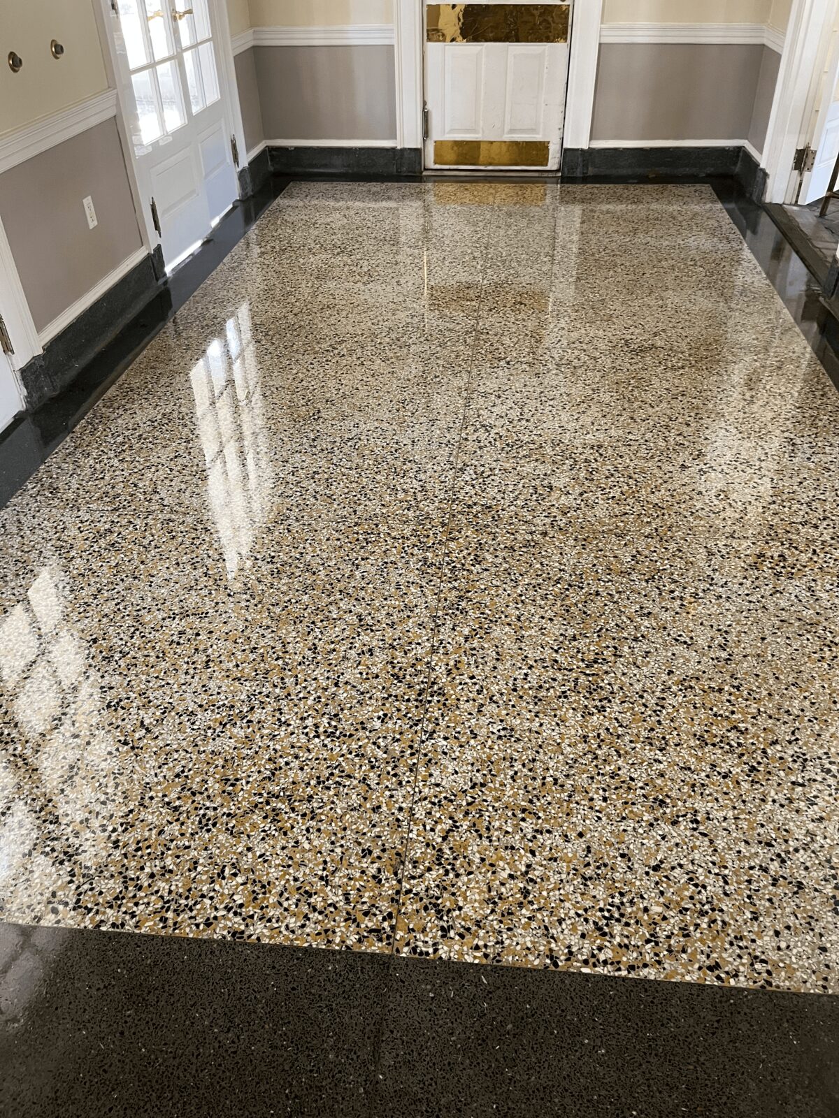High-gloss terrazzo floor after stripping and waxing by System4 of North Florida — Jacksonville commercial floor care